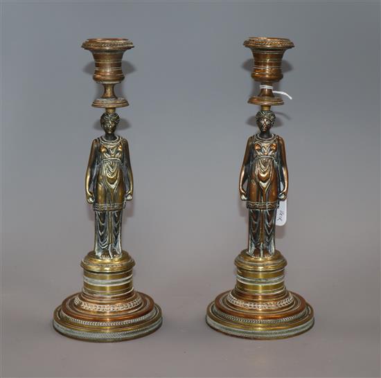 A pair of 19th century bronze caryatid candlesticks